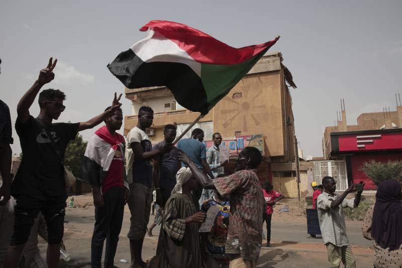 Anti-military protesters march on Friday, July 1, 2022 in Khartoum, Sudan, a day after nine people were killed in demonstrations against the country’s ruling generals.   (AP Photo / Marwan Ali)