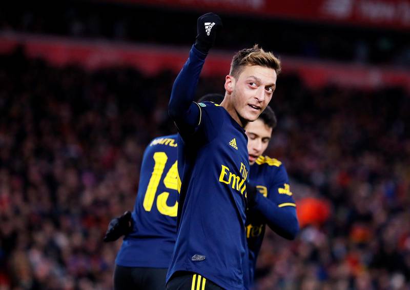 Arsenal's Mesut Ozil celebrates their fourth goal. Reuters