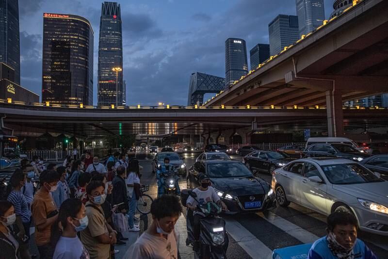 Cars drive past during evening rush hour in Beijing. EPA