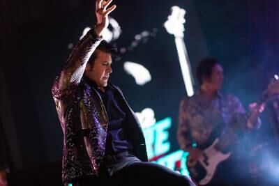 Elvis tribute artist Taylor Rodriguez performs during a show at the Parkes Leagues Club in Parkes, Australia. Getty Images