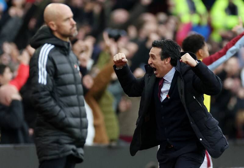 Aston Villa manager Unai Emery celebrates after Jacob Ramsey scores their third goal as Manchester United manager Erik ten Hag looks on. Reuters