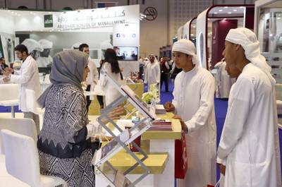 ABU DHABI, UNITED ARAB EMIRATES , October 31  – 2019 :- Students enquiring about the courses at the Al Ain University stand during the NAJAH higher education fair held at ADNEC in Abu Dhabi. ( Pawan Singh / The National )  For News. Story by John