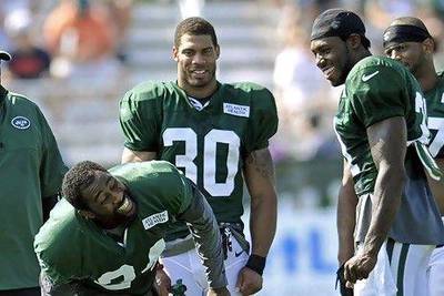 Antonio Cromartie can share a laugh now with his defensive back teammates Darrelle Revis, left, and LaRon Landry, centre, but it will be no laughing matter when he switches over to practice at wide receiver for some sets.