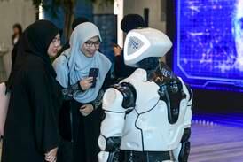 Guests are entertained by a robot at the Mohamed bin Zayed University of Artificial Intelligence. Robots could feature prominently in the future of work. Khushnum Bhandari / The National