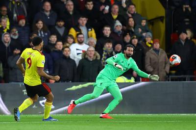 Watford captain Troy Deeney scored the third goal past Alisson Becker. Getty