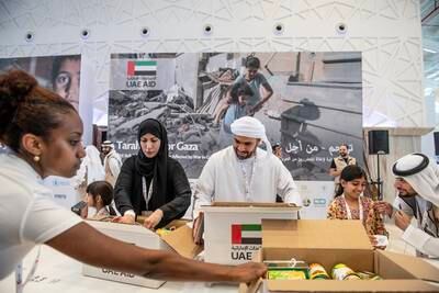 Volunteers in the UAE assembling boxes of essential provisions, including food, hygiene and medical supplies for Gaza. All photos: Vidhyaa Chandramohan for The National
