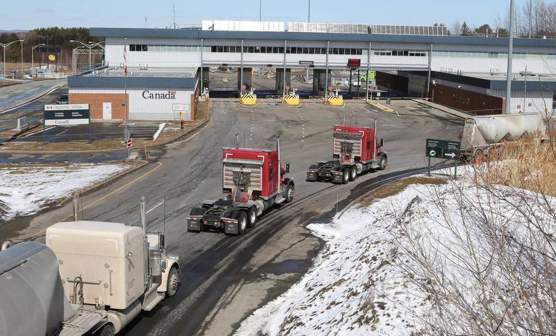 Vehicles are lined up at the US-Canada border in Derby, Vermont on March 18, 2020. Earlier in the day, US President Donald Trump and Canadian Prime Minister Justin Trudeau announced that the border would be closed to non-essential traffic. EPA