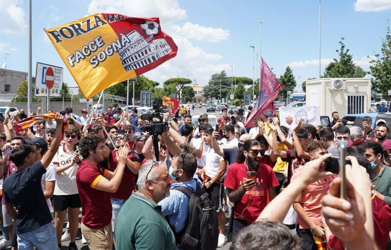 Roma fans wait for the arrival of new coach Jose Mourinho.