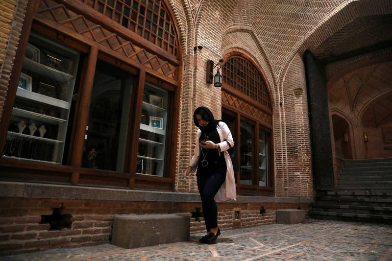 A woman walks through a part of the mostly empty Qazvin old traditional bazaar some 93 miles northwest of the capital Tehran, Iran. AP
