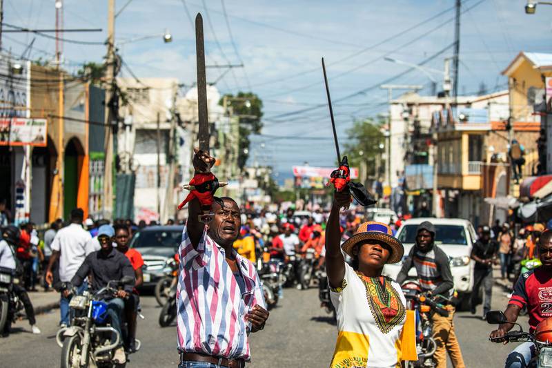 Haitians take to the streets to protest over increasing economic insecurity in the capital Port-au-Prince. AFP