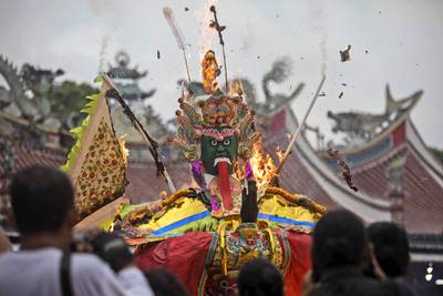 Ethnic Chinese burn a 'king of ghost" effigy during the festival in Medan, Indonesia. AP