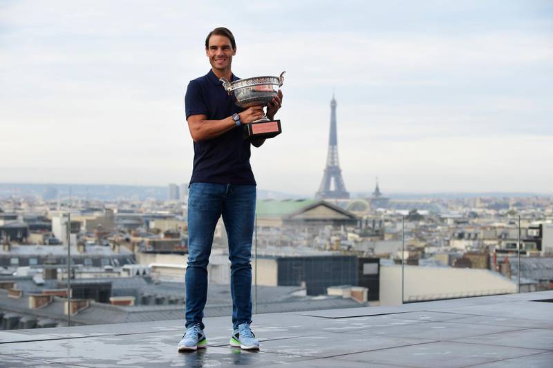 Rafael Nadal poses with the French Open trophy on the Galeries Lafayette Rooftop, Paris, a day after crushing Novak Djokovic in the men's final. EPA