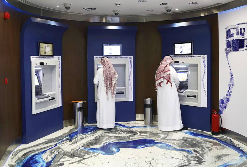 ATM machines at Al Rajhi Bank in Riyadh. The lender reported a 7 per cent drop in first-quarter net profit on higher operating expenses and impairment charge. Bloomberg