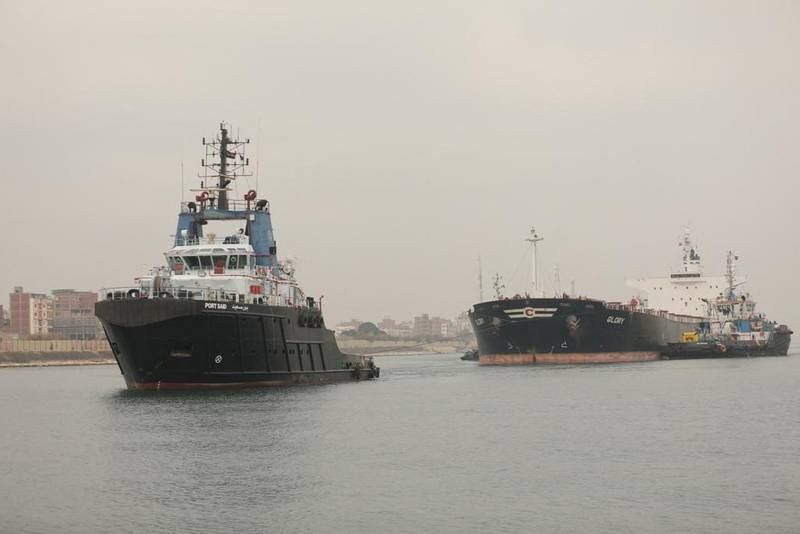 Suez Canal Authority tug boats tow the MV Glory after it became stuck in the waterway. Reuters
