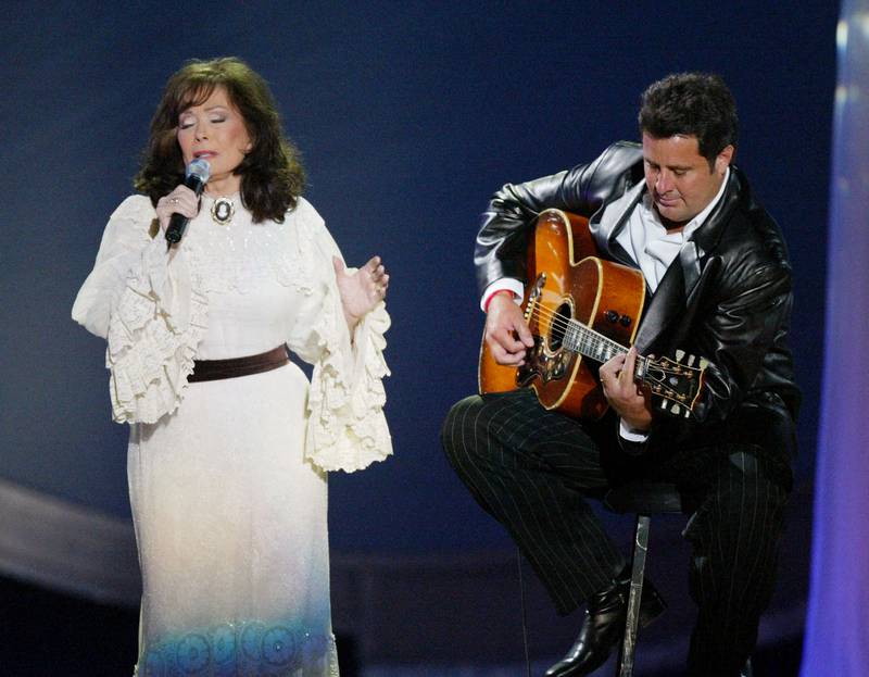  Lynn and Vince Gill perform on stage at the "39th Annual Country Music Awards" at the Mandalay Bay Hotel & Casino  in Las Vegas, Nevada. Getty Images / AFP