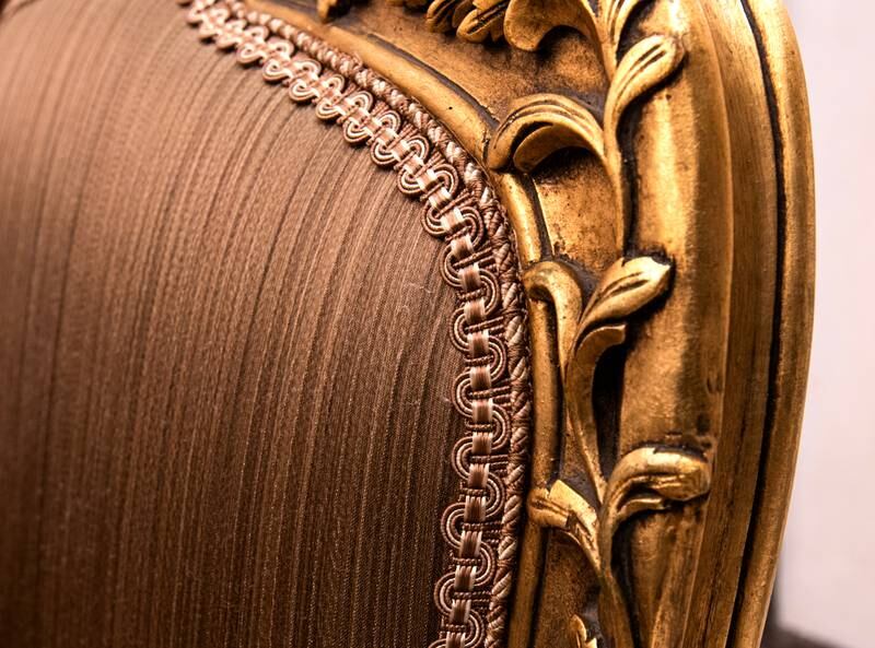 Intricate stitching and carved patterns on one of the dining chairs by Al Atrabi. 