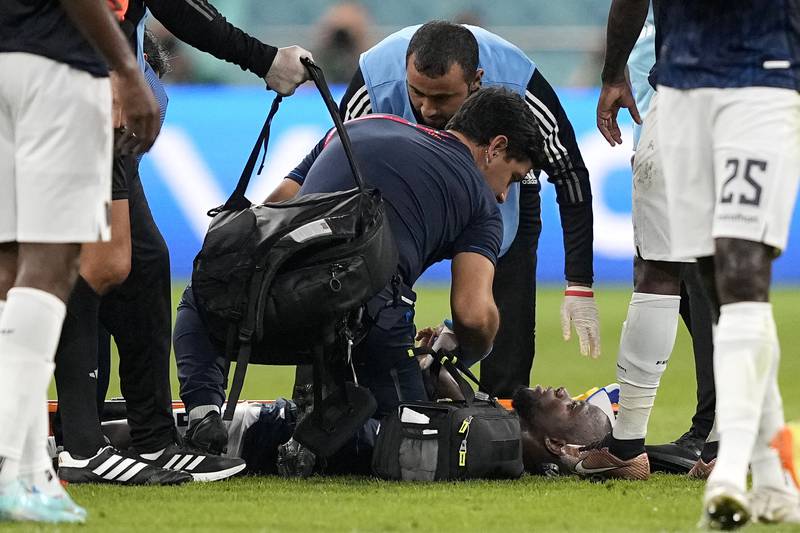 Enner Valencia lies injured on the pitch. AP