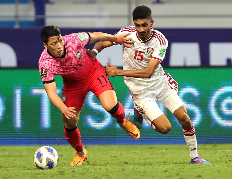 South Korea's Hee-Chan Hwang battles for possession with Mohammed Al Baloushi of the UAE. Reuters