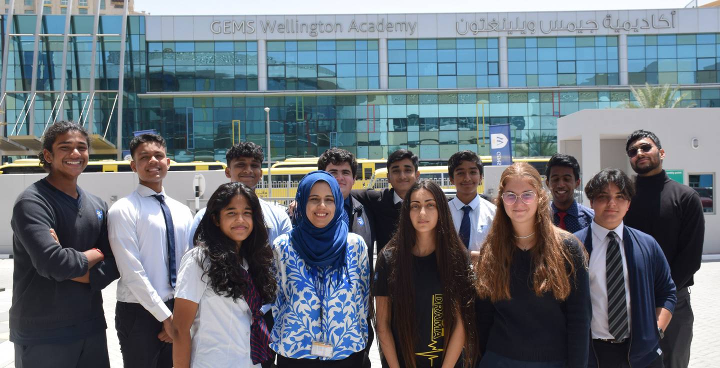 The pupils at Gems Wellington Academy - Silicon Oasis in Dubai who won the top prize. Back Row: Akshay Biju; Jordan Justin Desouza; Tarun Chandra; Matthew Andreopoulos; Shayaan Ather Hashmi; Mustansir Huned Ujjainwala; David Emmanuel Kalarickal; and Eeshan Singh Bhogal.
Front Row: Amraa Animon; Shafaque Riaz, head of information and communications technology at the school; Aya Ballout; Sara Al Qaisi; and Adrian Guillen. Another pupil, Anastasia Kajalic, was not present when the photograph was taken. Photo: Gems Education