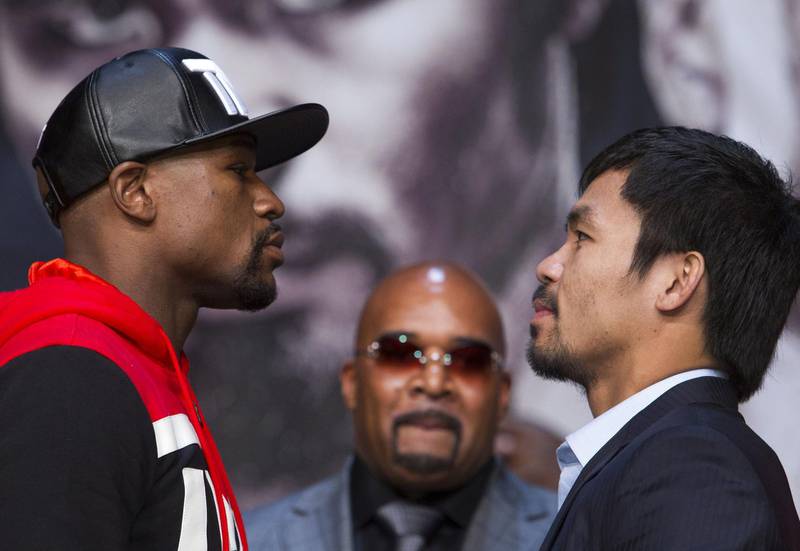 Floyd Mayweather and Manny Pacquiao face-off ahead of their fight. Reuters