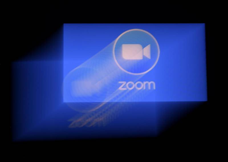 (FILES) In this file photo illustration taken on March 29, 2020, a Zoom App logo is displayed on a smartphone in Arlington, Virginia.  


Facebook on April 24, 2020, took aim at videoconferencing startup Zoom with virtual "rooms" where friends can pop in for visits via online video as part of an effort to help users locked down during the pandemic.
 / AFP / Olivier DOULIERY
