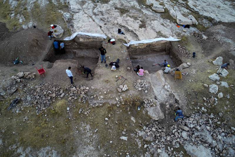 A team of Iraqi-Kurdish and Italian archaeologists excavate an ancient irrigation canal near Faydeh, in the Nineveh region.