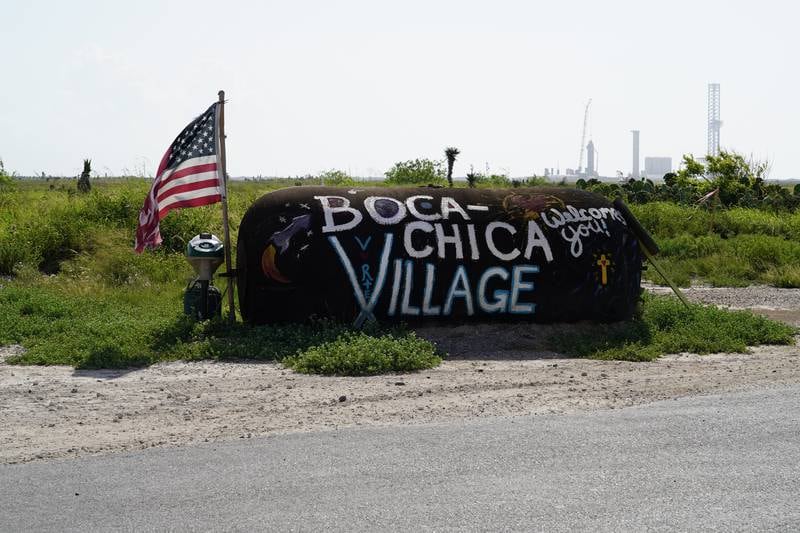 A sign welcomes visitors to Boca Chica Village. 