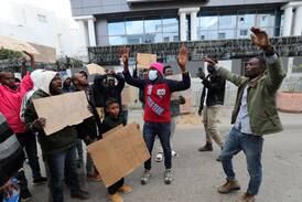 Sub-Saharan African migrants protest outside the headquarters of the International Organisation for Migration in Tunis to demand their repatriation from Tunisia. EPA