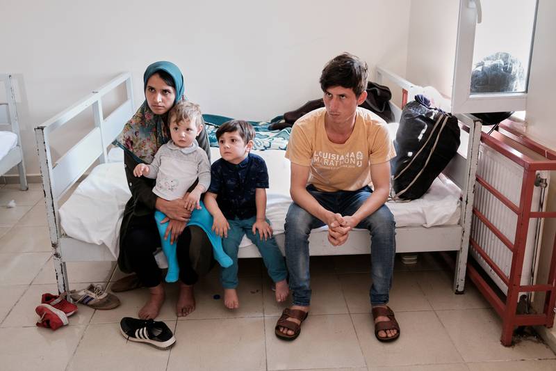 Afghan migrant couple Sayyed Fahim Mousavi and Morsal Mousavi, caught by Turkish security forces after crossing illegally into Turkey from Iran, are pictured with their children at a migrant processing centre in Van. Reuters