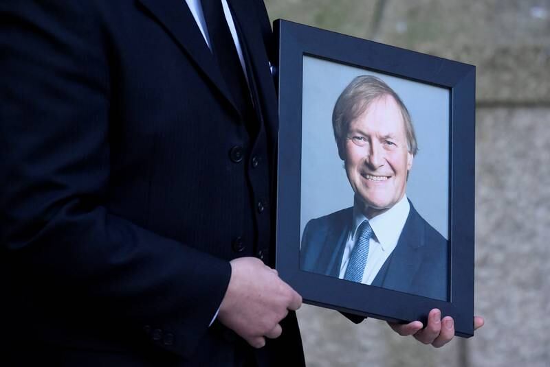 A portrait of Amess is carried into Westminster Cathedral. Reuters