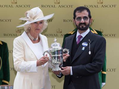 ASCOT -UK - 18 June 2013: Royal Ascot day one. 
Camilla, Duchess of Cornwall present the St James's Palace Stakes trophy to owner of the winning horse, Dawn Approach, HH Sheikh Mohammed bin Rashid Al Maktoum, Ruler of Dubai.
Photograph by Ian Jones *** Local Caption ***  IJP-17-6-13-Royal-Ascot-87.jpg IJP-17-6-13-Royal-Ascot-87_2.jpg