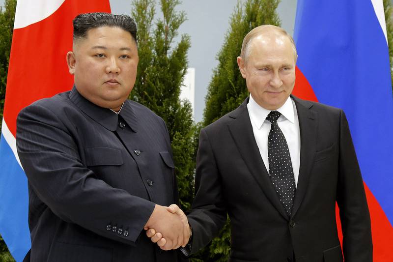 Russian President Vladimir Putin and North Korea's leader Kim Jong-un shake hands during a 2019 meeting in Russia. AP