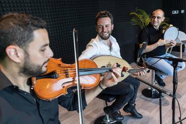 Faraj Abyad performs in studio with violinst Yarub Smairat and percussionist Firas Hassan at The National headquarters in Abu Dhabi. Antonie Robertson/The National 