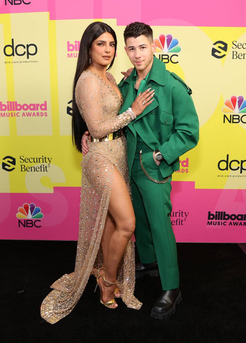 Chopra and Jonas backstage at the Billboard Music Awards on May 23, 2021, at Microsoft Theatre in Los Angeles, California. Getty via AFP