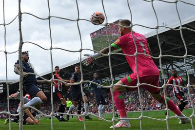 Tottenham Hotspur's Cristian Romero heads home the opening goal. AFP
