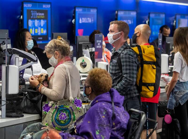 Travellers check in for their flights at LAX in Los Angeles, California. Getty Images