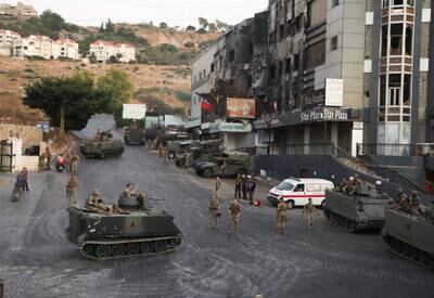 Lebanese soldiers take up position in Khalde after a gun attack on a Hezbollah funeral.