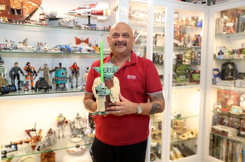 Ketan Shah with his collection of 60,000 comic books, Star Wars souvenirs, chewing gum wrappers, cigar wrappers and Lego items at his villa in Dubai. Pawan Singh / The National