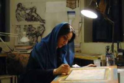 Iranian Painter Farah Ossouli is painting in her studio in Tehran.02/12/2008 Photo Credit Tara for The National  *** Local Caption ***  KOW_0254.jpg