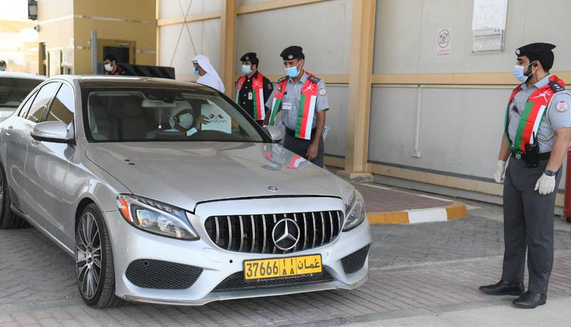 Those arriving in Abu Dhabi were welcomed by police officials to celebrate the return of traffic via road between the two countries.