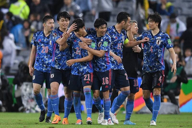 Kaoru Mitoma celebrates with teammates after scoring against Australia. EPA