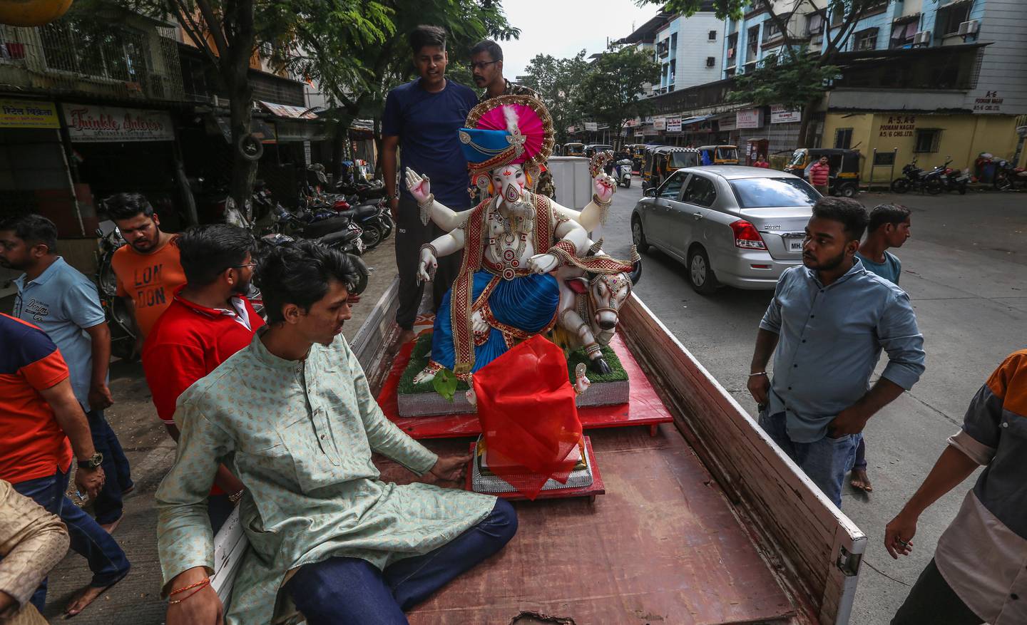 Indian devotees transport an idol of the elephant-headed Hindu god Ganesh in Mumbai, India, on August 31, 2022.  The Ganesh Chaturthi festival is a 10-day event celebrated all over India. EPA