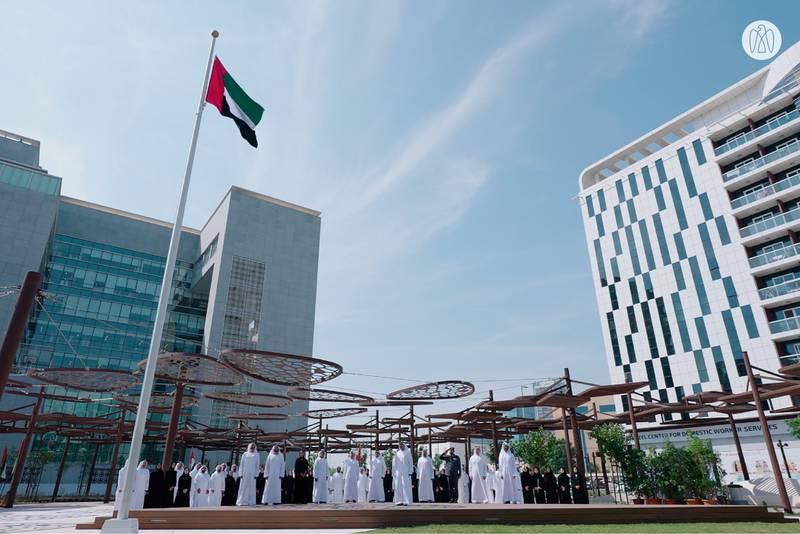 The UAE flag is raised at Abu Dhabi Executive Office. Photo: AD Media Office
