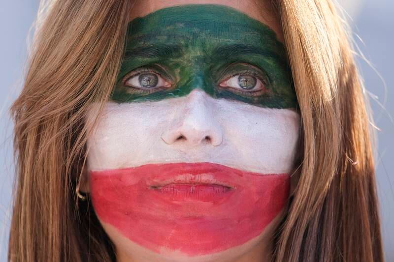 A woman with the colours of the Iranian flag painted on her face participates in a rally as thousands demonstrate in support of Iranian women in Los Angeles. EPA