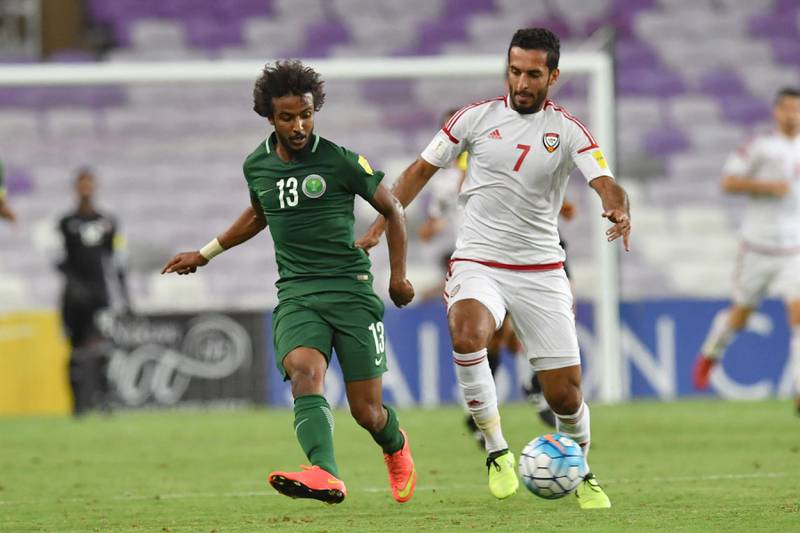 UAE's forward Ali Ahmed Mabkhout (R) fights for the ball with Saudi's defender Yasir Alshahrani during the 2018 FIFA World Cup qualifier football match between UAE and Saudi Arabia at the Hazza Bin Zayed Stadium in Al-Ain on August 29, 2017. / AFP PHOTO / GIUSEPPE CACACE