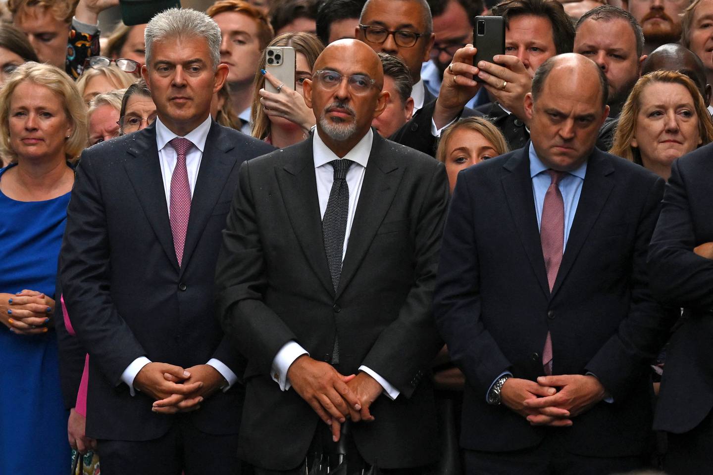Former chancellor Nadhim Zahawi waits alongside former Northern Ireland secretary Brandon Lewis and Britain's Defence Secretary Ben Wallace for newly appointed Prime Minister Liz Truss to deliver a speech outside 10 Downing Street on Tuesday. AFP