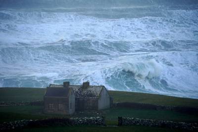 Waves crash against the shore in Doolin. PA