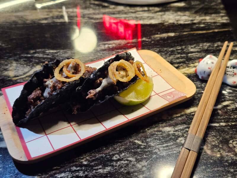 The excellent beef tacos are served in a crunchy nori shell. Photo: Gimi