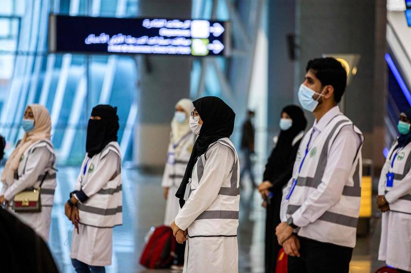 A handout picture provided by the Saudi Ministry of Hajj and Umra on July 25, 2020, shows members of the medical team from Saudi Health ministry awaiting the first group of arrivals for the annual Hajj pilgrimage, at the Red Sea coastal city of Jeddah's King Abdulaziz International Airport. The 2020 hajj season, which has been scaled back dramatically to include only around 1,000 Muslim pilgrims as Saudi Arabia battles a coronavirus surge, is set to begin on July 29. Some 2.5 million people from all over the world usually participate in the ritual that takes place over several days, centred on the holy city of Mecca. This year's hajj will be held under strict hygiene protocols, with access limited to pilgrims under 65 years old and without any chronic illnesses. - === RESTRICTED TO EDITORIAL USE - MANDATORY CREDIT "AFP PHOTO / HO / MINISTRY OF HAJJ AND UMRA" - NO MARKETING NO ADVERTISING CAMPAIGNS - DISTRIBUTED AS A SERVICE TO CLIENTS ===
 / AFP / Saudi Ministry of Hajj and Umra / - / === RESTRICTED TO EDITORIAL USE - MANDATORY CREDIT "AFP PHOTO / HO / MINISTRY OF HAJJ AND UMRA" - NO MARKETING NO ADVERTISING CAMPAIGNS - DISTRIBUTED AS A SERVICE TO CLIENTS ===
