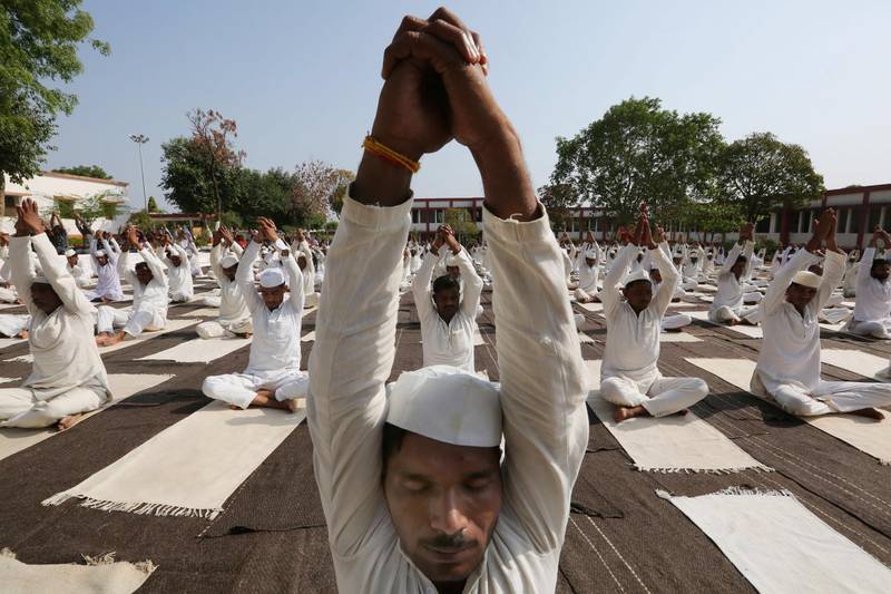 Inmates of Central Jail take part in a mass yoga session on the occasion of the fourth International Day of Yoga in Bhopal, India. Sanjeev Gupta /  EPA